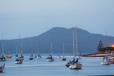 Brent Neighbour; Shifting Boats; Time exposure showing boats moving with the tide/wind. Taken from Bucklands Beach with Rangitoto in the Background