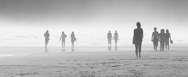 JOHN PIRTLE; THE BEACH WALKERS; Taken Easter Monday, Piha Beach, North End. Panasonic Lumix Digital, 35 400mm Leica Elmarit lens @ 400mm. Film equivalent ASA 80