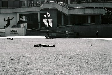 Ellenette Nusbaum;Noon. Aotea Square; This is part of a series of images I took during a walk through Auckland City at lunch time. This man opted for sun time at lunch time in Aotea Square.