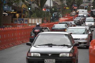  Orange baricades line road works on Queen Street