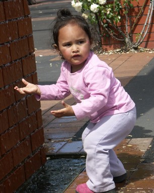  Taken in New Lynn a little girl found the water fascinating