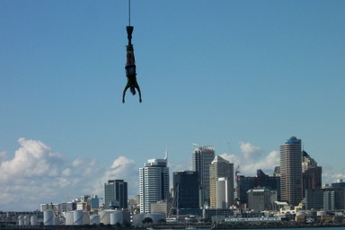 Nouran Ragaban; Over the City; A bungee jumper takes a leap off the Auckland Harbour Bridge and looks like she's got the city at her fingers.