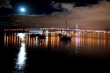 Aldo Coetzee;The Moon; The moon reflecting with Auckland harbour bridge and Skytower in background