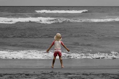 Gina Jessop; Piha; A little girl running out to sea during the Hyndai Surf Nationals at Piha