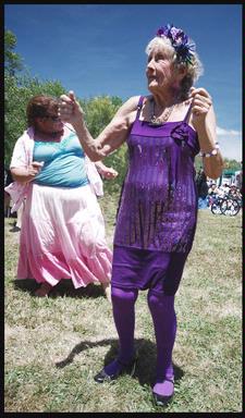  This Elvis fan was given the purple outfit by her family for her 90th birthday. She is dancing at Elvis in the Park in Henderson this month