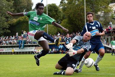 Grant Stantiall; Airborne Strike; Auckland City FC goalkeeper Ross Nicholson saves a mid air shot from Manawatu striker Commins Menapi.