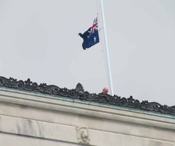 Joan Kirk; lowering flag from on High; Flag person on roof of Auckland war memorial