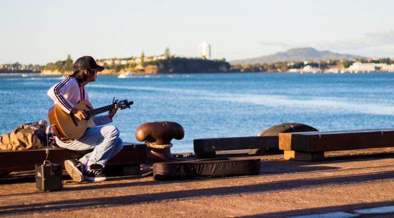 Edward Swift;Busking on the waterfront;A man busking at Wynyard Quarter in Auckland
