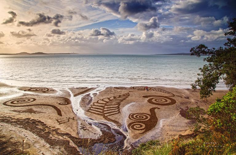 Anupan Hatui; A snapshot of the beautiful sand works fresh from the St Heliers beach ... Just while i was about to Call it a day, these art works caught my eye and i am glad to capture the same in my lens ... Koru, Fern, Moana .... — at St Heliers Beach.