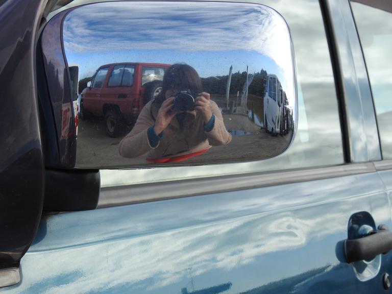 Denise Poyner; Sort of Selfie; I took this at the Springs Road boat ramp. The chrome rear of a side mirror made a good surface for reflecting myself as the photographer.