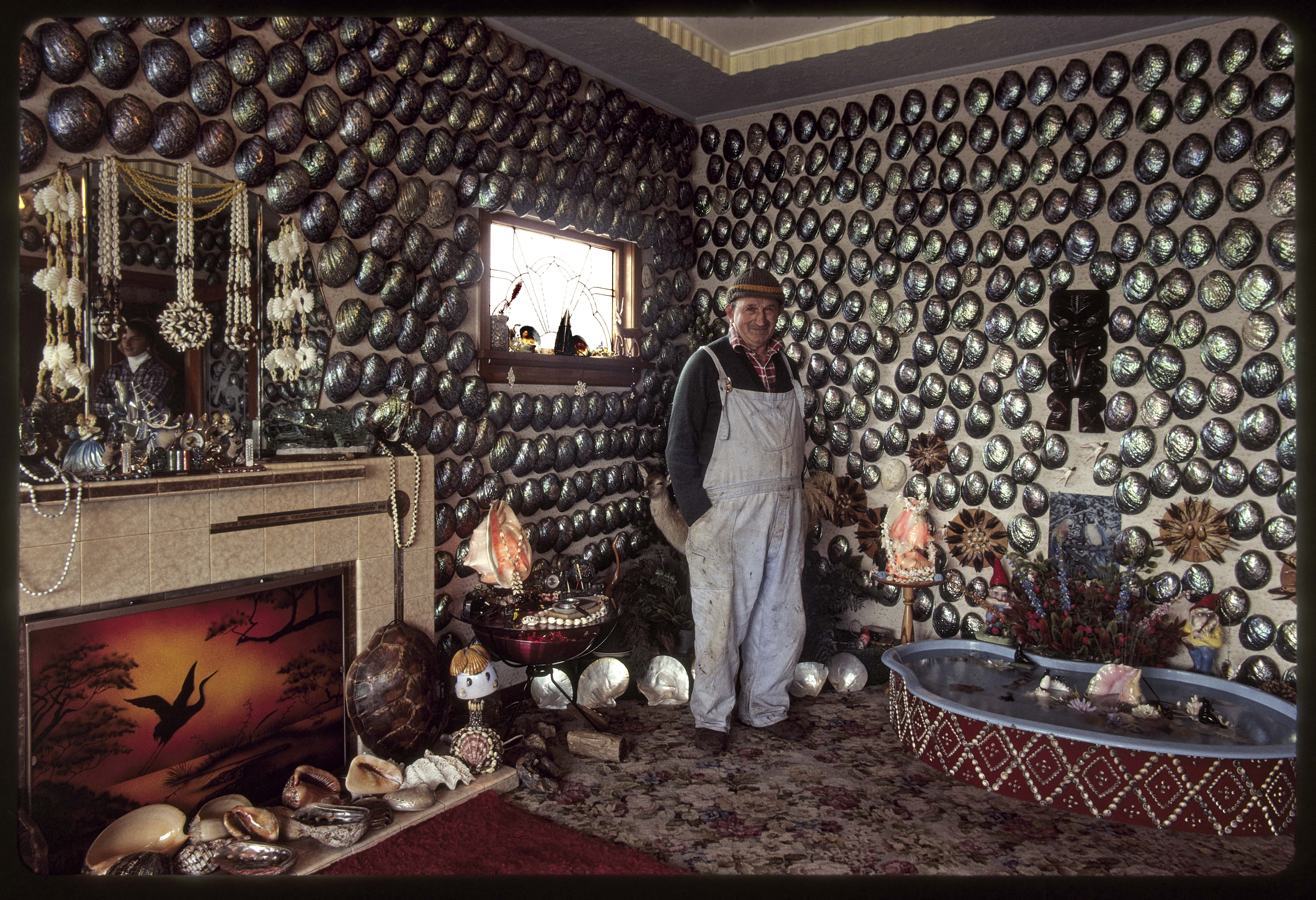 Robin Morrison. 1979. Fred Flutey in his pāua shell living room, Bluff. Auckland Museum. © Robin Morrison Estate