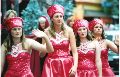 Julia Cotton; Pretty in Pink;Soft on the colourful pink costumes in 2005 Santa Parade