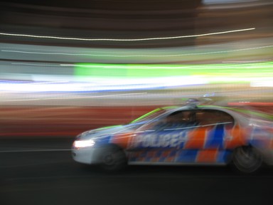  A Police car cruises quietly down Queen Street one Saturday evening