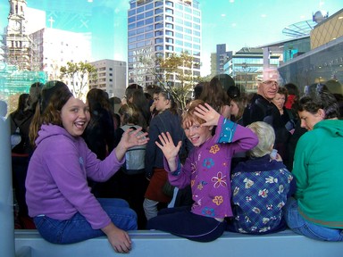  This was taken outside The Edge (in the city), when our school went to see a show there. It was taken through glass, so the upper half of the shot was a reflection of what was behind me. I think this photo echos the friendly, easy-going vibe of Auckland.