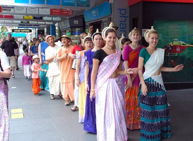 Hare Krishna's of all ages, marching down Queen Street