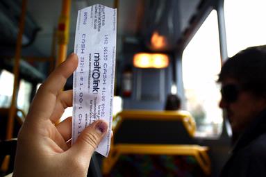 Natalee Tan; stop the bus; myself holding a bus ticket as the yellow light comes on, telling the bus driver to stop the bus.