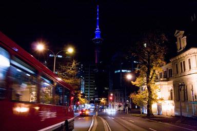 Helen Williamson;I was on my way to help out with props and set at a musical by Auckland Uni students when I noticed this to my left and saw the street scene with the Sky Tower and Art Gallery, the colours looked so great together I photographed that. 2008