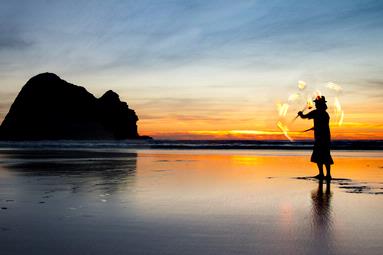 Nazar; Juggler at Piha; It was Christmas day and for sunset i went to Piha beach, Beautiful sunset and find this fellow playing with fire.