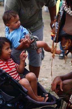 Aubrey Rodriguez; Papua New Guinea 2010; Kids... getting up close and personal with the Sepik warrior