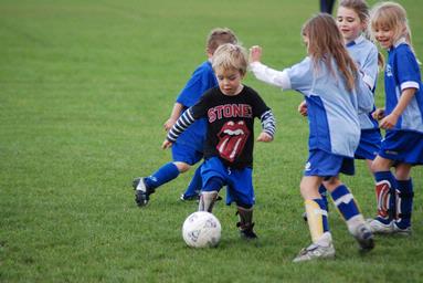  This little guy is filling in for the opposition against his sisters all girl team.  More than slightly determined to win!