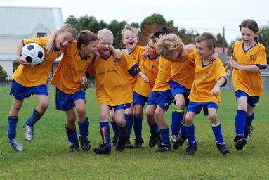  Only a bunch of children could get as much action into a football shot without even playing a game.  This was the keep still moment in the team photo!  These are the right kind of Soccer Hoolligans!