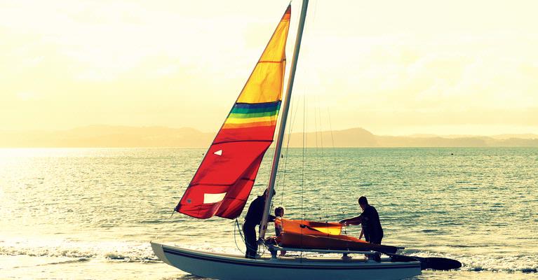 Justine Sanderson; Making your own rainbow; A family taking their sailing boat out,  Manly Beach, Whangaparaoa