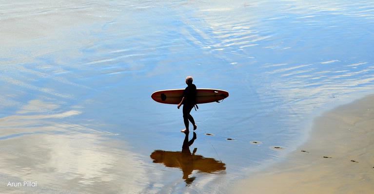 Arun Sarasakshan Pillai; To conquer the waves..; Surfer heading to the surf, Muriwai beach