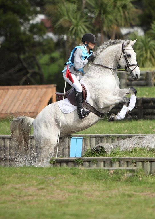 carolyn; Getting Out Of The Water; A horse puts a lot of effort into jumping out of the water jump at Henderson Pony Club ODE