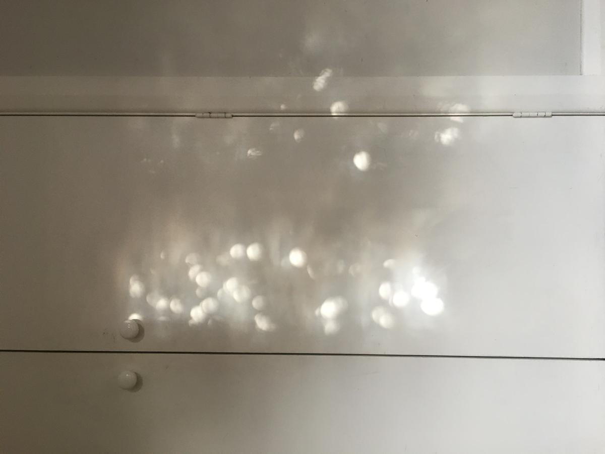 Adrienne Miller; Bubbles in our bubble; Light reflections on the office cupboard