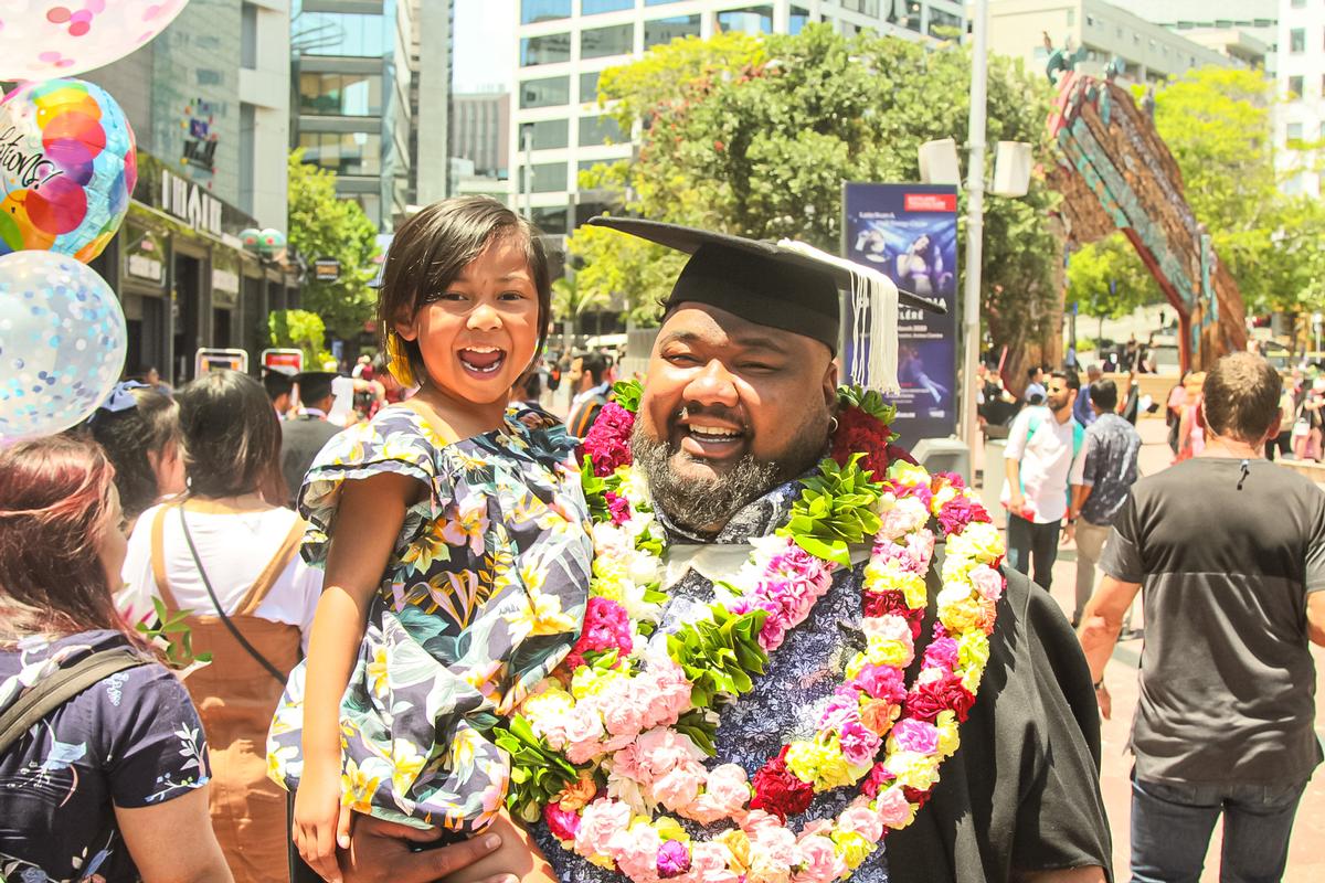 Navarone Toalepai; The Master and His Daughter ;A photo of my mentor Eti and his young daughter after he graduated with his masters. This photo for me signifies a fathers sacrifice in order to achieve something precious to set an example of excellence and commitment for his daughter. This day brought a lot of joy to my spirit as an undergraduate as I studied many long nights with Eti during the last stages of his masters, I was there during the brief moments where he was unsure and when he celebrated the little wins.. all i can say is that smile is the smile of a conqueror .
