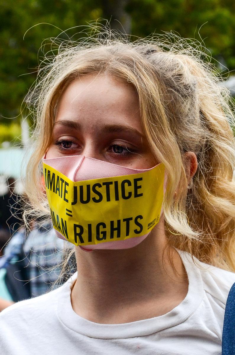 Angel Jacobson; Silenced; This was taken at the recent Intergenerational Climate Strike. A girl has a sticker across her mask   it reads,