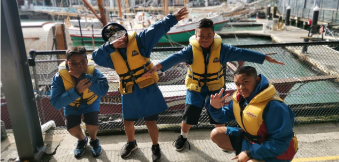 Angellynah; Boys dancing with life jackets for no reason ;Boys that are about to go sailing