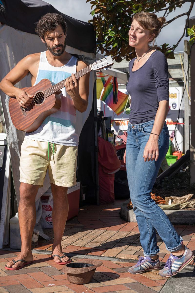 Gebhard Krewitt;#0926	Susanna Pozzi, 26, Milano, ITL, graphic designer, singer   Javier Rodriguez, 34, Buenos Aires, ARG, musician, actor;song4you: There is nothing nicer in Nelson than going to the market on a Saturday morning, meeting people, drinking a coffee and just inhaling the atmosphere. A part of this atmosphere is purely acoustic in nature and is created by the many street musicians and buskers, which you can see and hear on your way from the parking area to the sausage stall in the center of the market. One half of these musicians performing at the Saturday market are locals, the other half comes from many other places including overseas, to Nelson to a very grateful audience. In recent years, Gebhard Krewitt has photographed many of these musicians in his very own documentary way, in order to highlight the particularity of each individual musician.