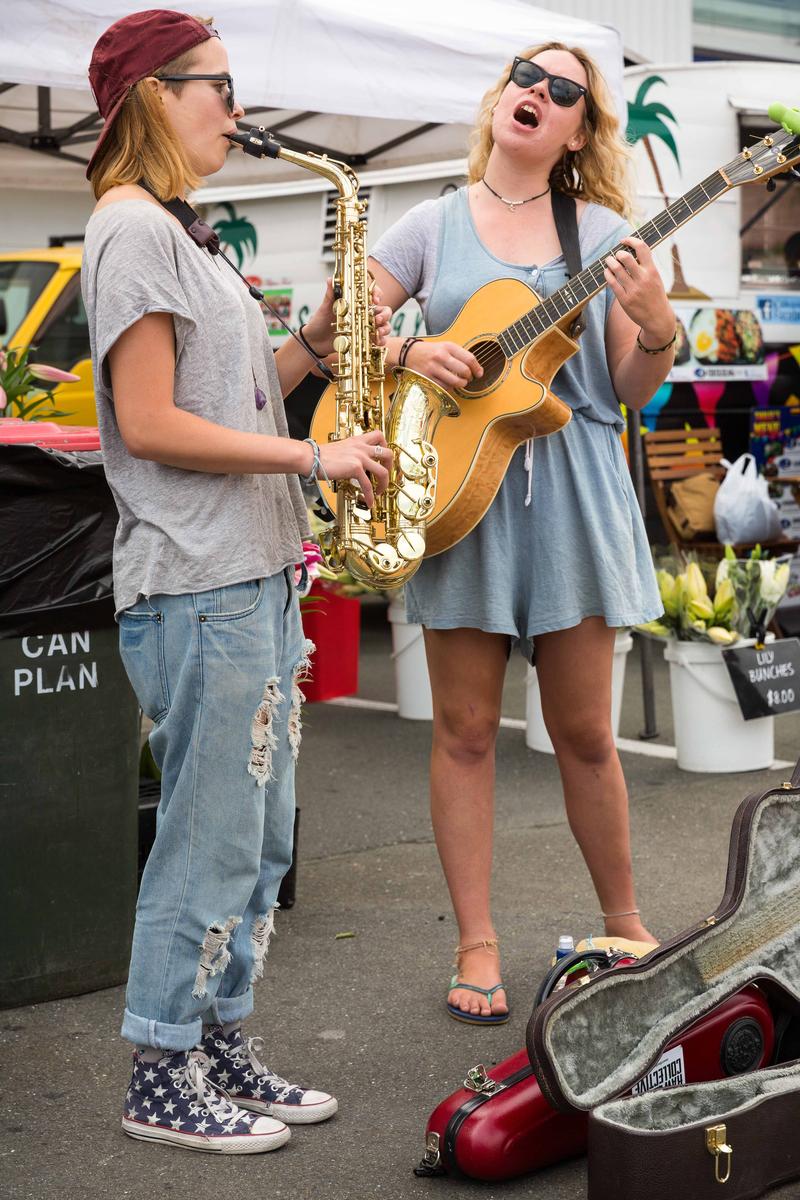Gebhard Krewitt;#2049	Eilish Wilson, 21, saxophone, Nelson, student, musician   Sophie Cooper, 19, Nelson, student, musician;song4you: There is nothing nicer in Nelson than going to the market on a Saturday morning, meeting people, drinking a coffee and just inhaling the atmosphere. A part of this atmosphere is purely acoustic in nature and is created by the many street musicians and buskers, which you can see and hear on your way from the parking area to the sausage stall in the center of the market. One half of these musicians performing at the Saturday market are locals, the other half comes from many other places including overseas, to Nelson to a very grateful audience. In recent years, Gebhard Krewitt has photographed many of these musicians in his very own documentary way, in order to highlight the particularity of each individual musician.