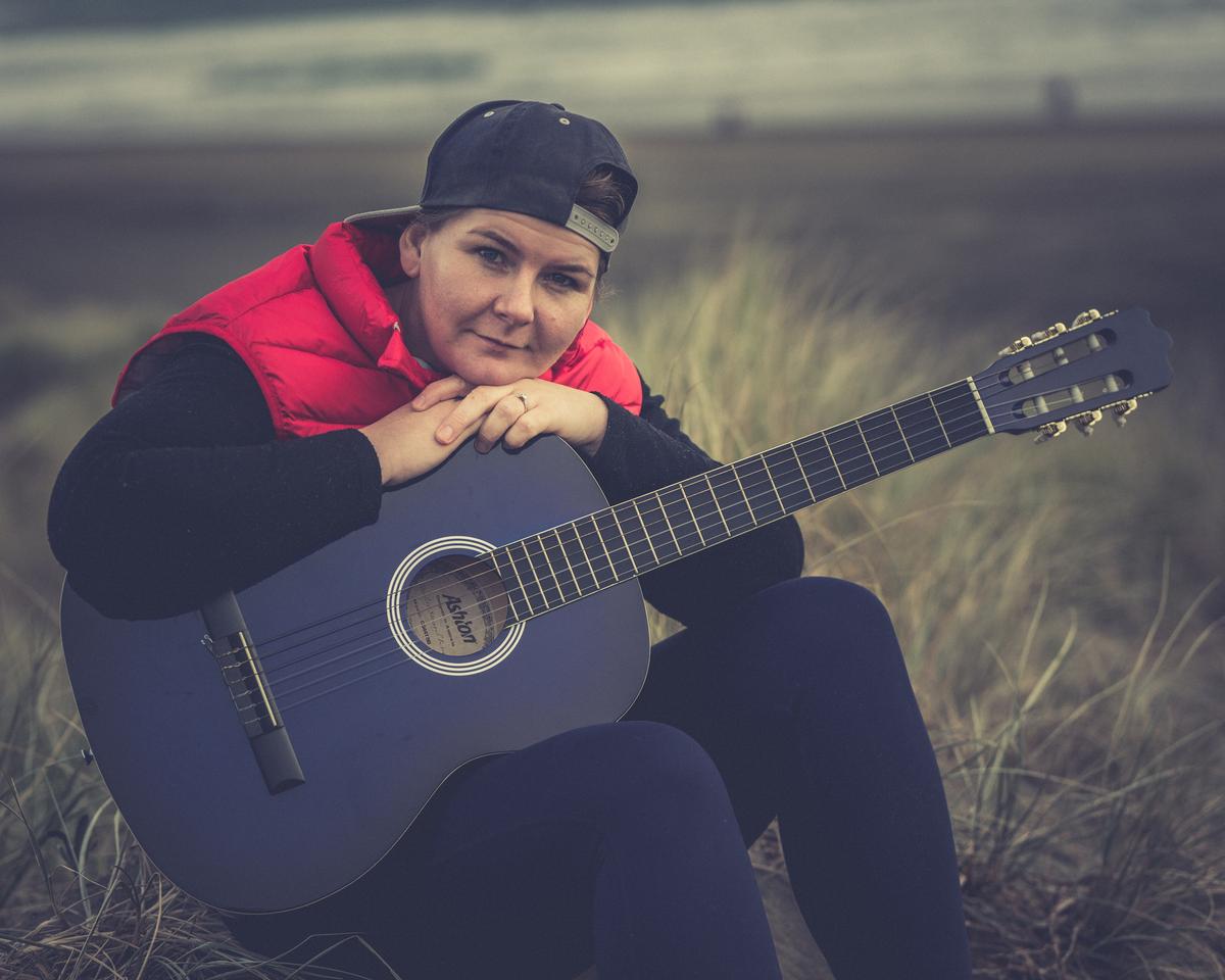 Paul Belli; Break for a portrait shot;Piha Beach is as good a place as any to practice the guitar, maybe the best with the views and the vibe.