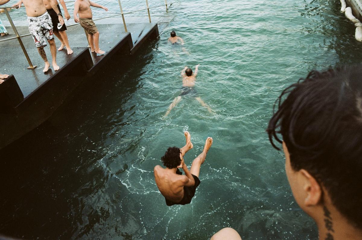 Doujia Liu;Summer Carnival;At the end of summer, A group of youths gathered together at the seaside and enjoyed the last summer time of the year. They jumped tirelessly into the sea, over and over again.I  stood beside them, I pressed the shutter when they laughed and jumped into the water