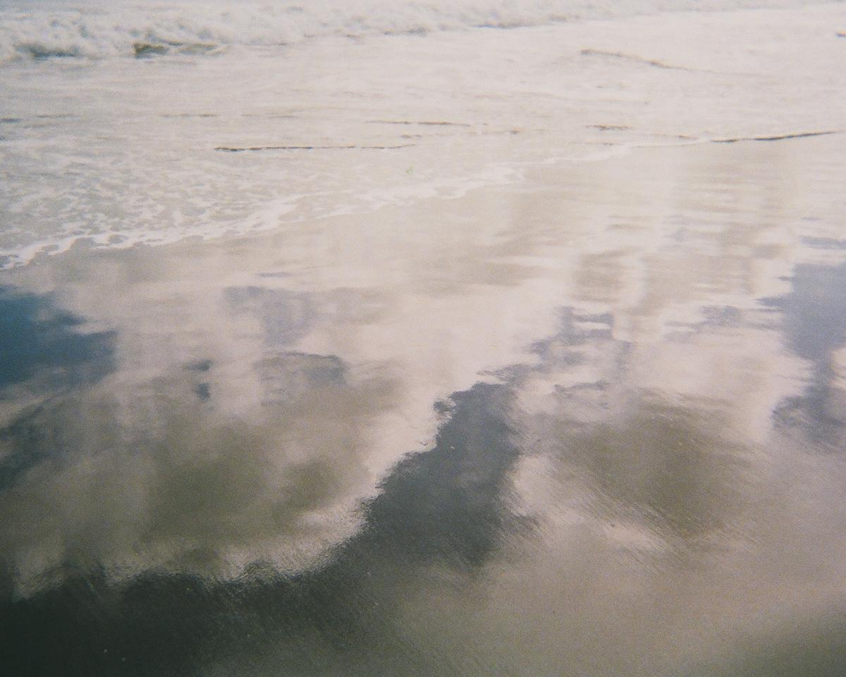 Nabeel Hassan; I captured this photograph in South Piha when my friend and I had a medium format vs disposable camera challenge. I captured this photograph on a 20 dollar Kodak Disposable camera. I guess it goes to show you that gear doesn't matter as much as we make it out to be