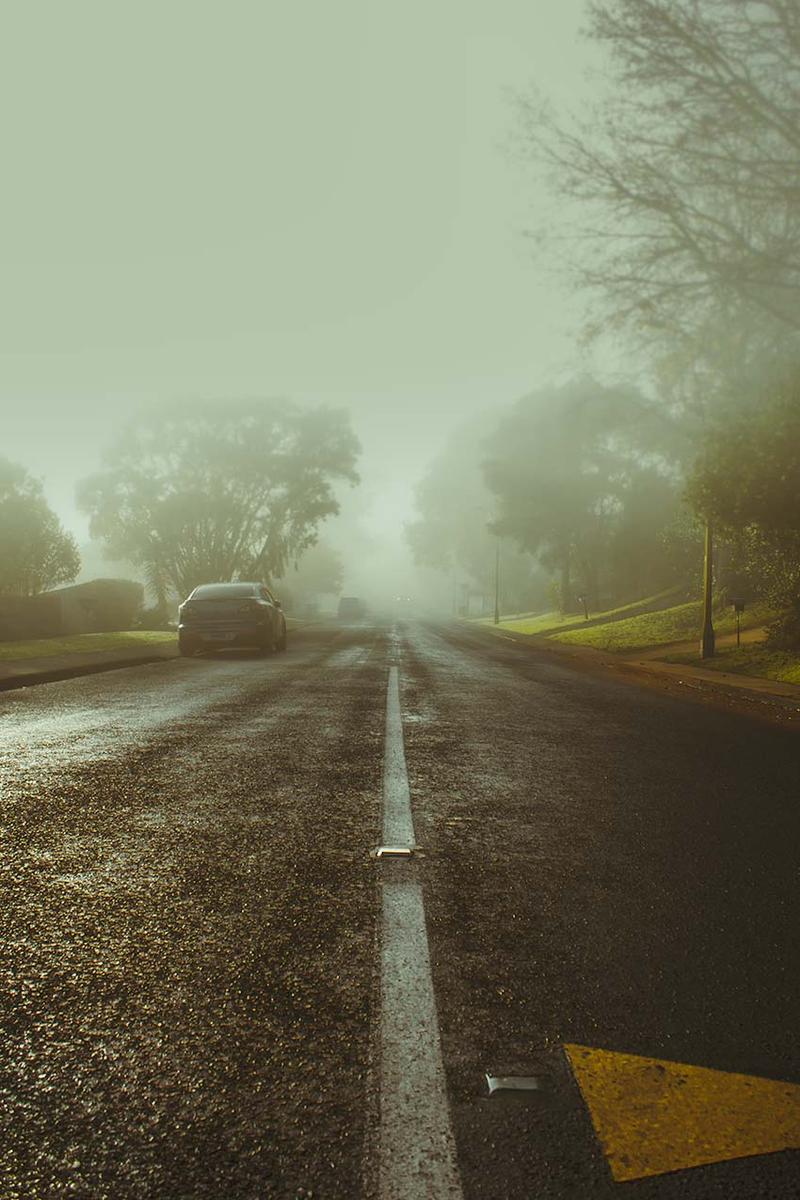 Ryo Nishikawa;Mysterious street ;We never know what's to come even when the path is wide and straight. Just like how hard it is to see the head lights of the car in the fog in this photo. The photo is a representation of uncertainty in your life.