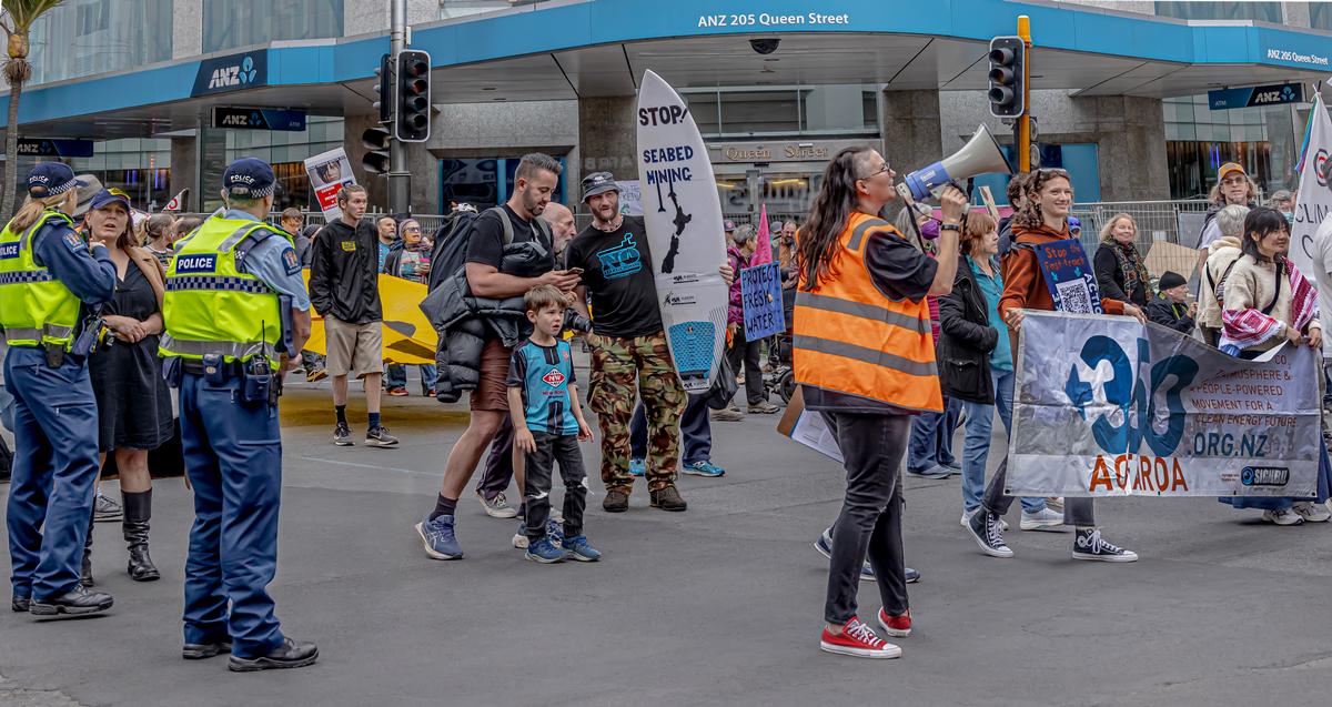 Margaret V Vickers;This image shows the Greenpeace March for Nature proceeding down Queen Street, Auckland. People from far and wide, shared the conviction that they want to reject this Government's attack on nature, on democracy and on Te Tiriti o Waitangi.