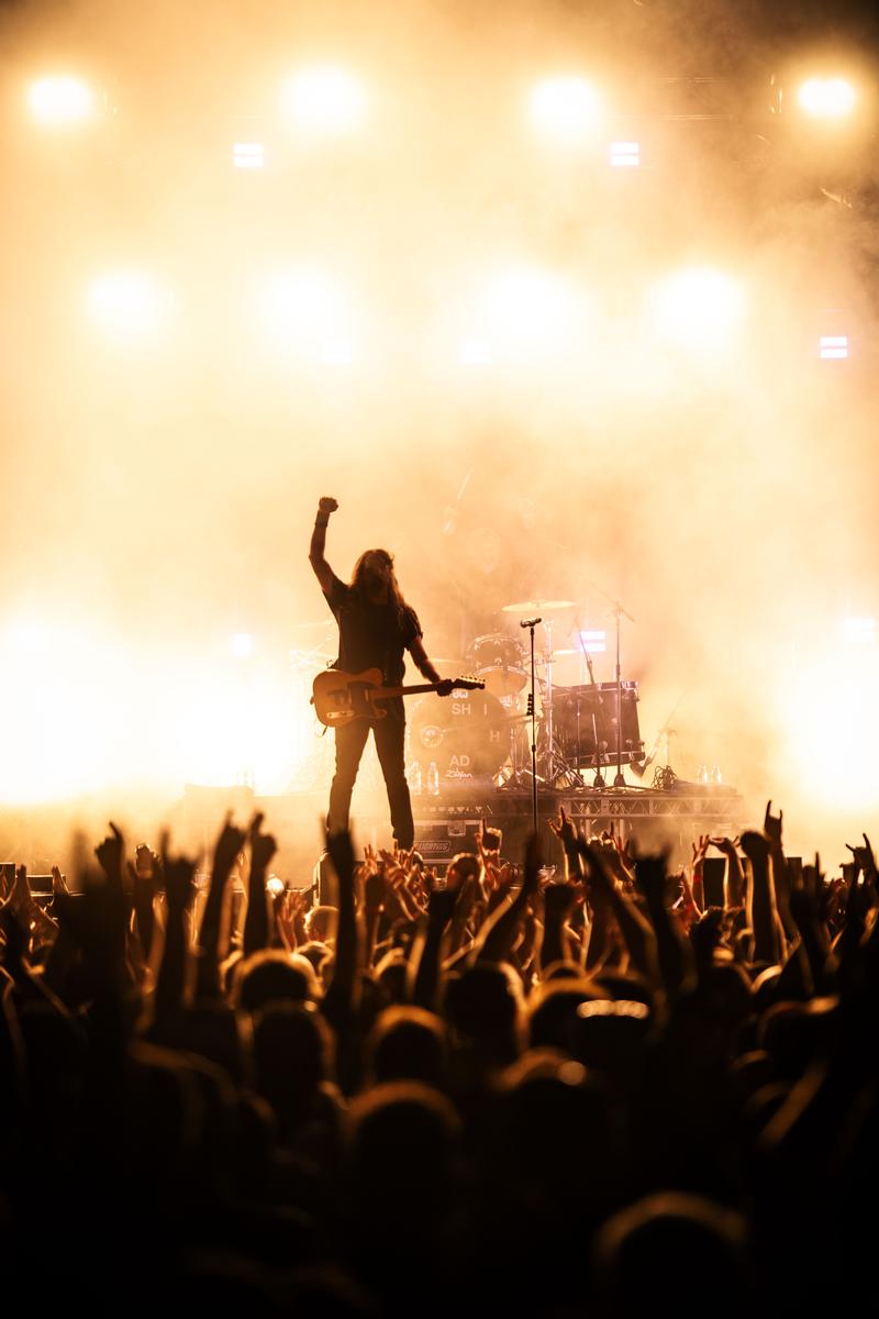Alec Huisman;Jon Toogood of Shihad at QEII Park, Christchurch;Jon Toogood raises a fist in the air at Shihad's final show in Ōtautahi, 2025