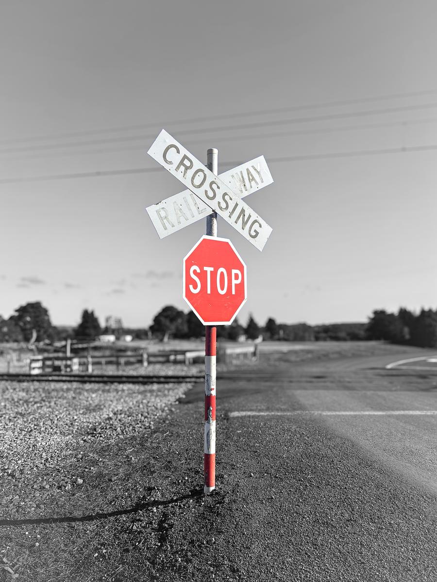 Harry;STOP;This photo was taken at a small railroad crossing on the desert road, I really liked the way the colours from the red stop sign.