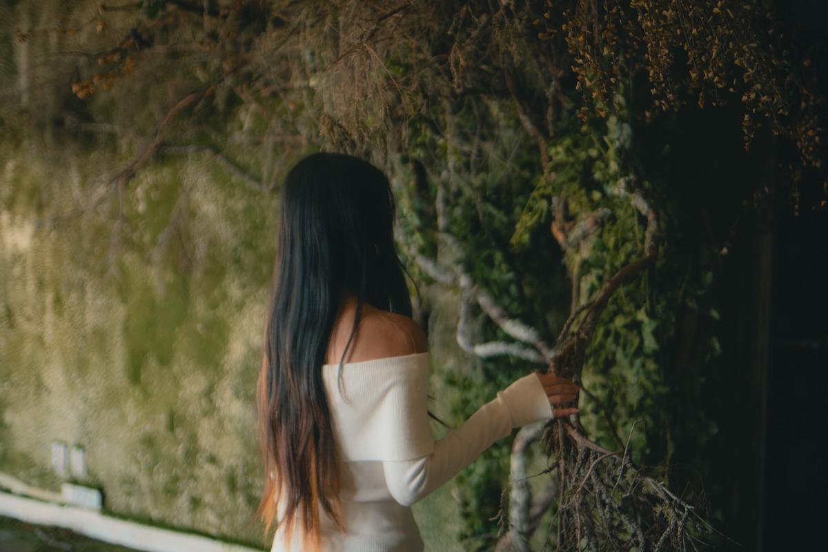 Lucas Lin;Natures Hand;22/03/25. A serene moment capturing the quiet connection between a girl and nature, where stillness speaks louder than words.
