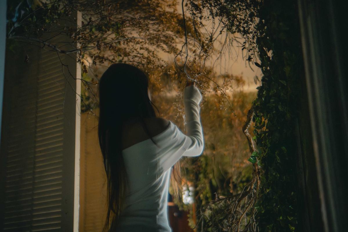 Lucas Lin;Beneath it;22/03/25. Reaching into the tangle of nature, she bridges the quiet tension between curiosity and decay.