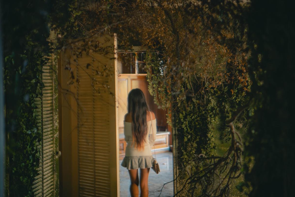 Lucas Lin;Undergrowth;22/03/25.  A modern figure steps through an overgrown doorway, blurring the line between decay and discovery.