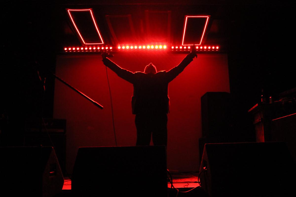 Mars Cook;Ritual;This is a photo taken of noise artist MDTH at Whammy Bar. The performance was even more intense than this photo looks, it felt like a summoning ritual of some kind. I used a low angle to emphasize his sillhouette and to make the viewer feel small.
