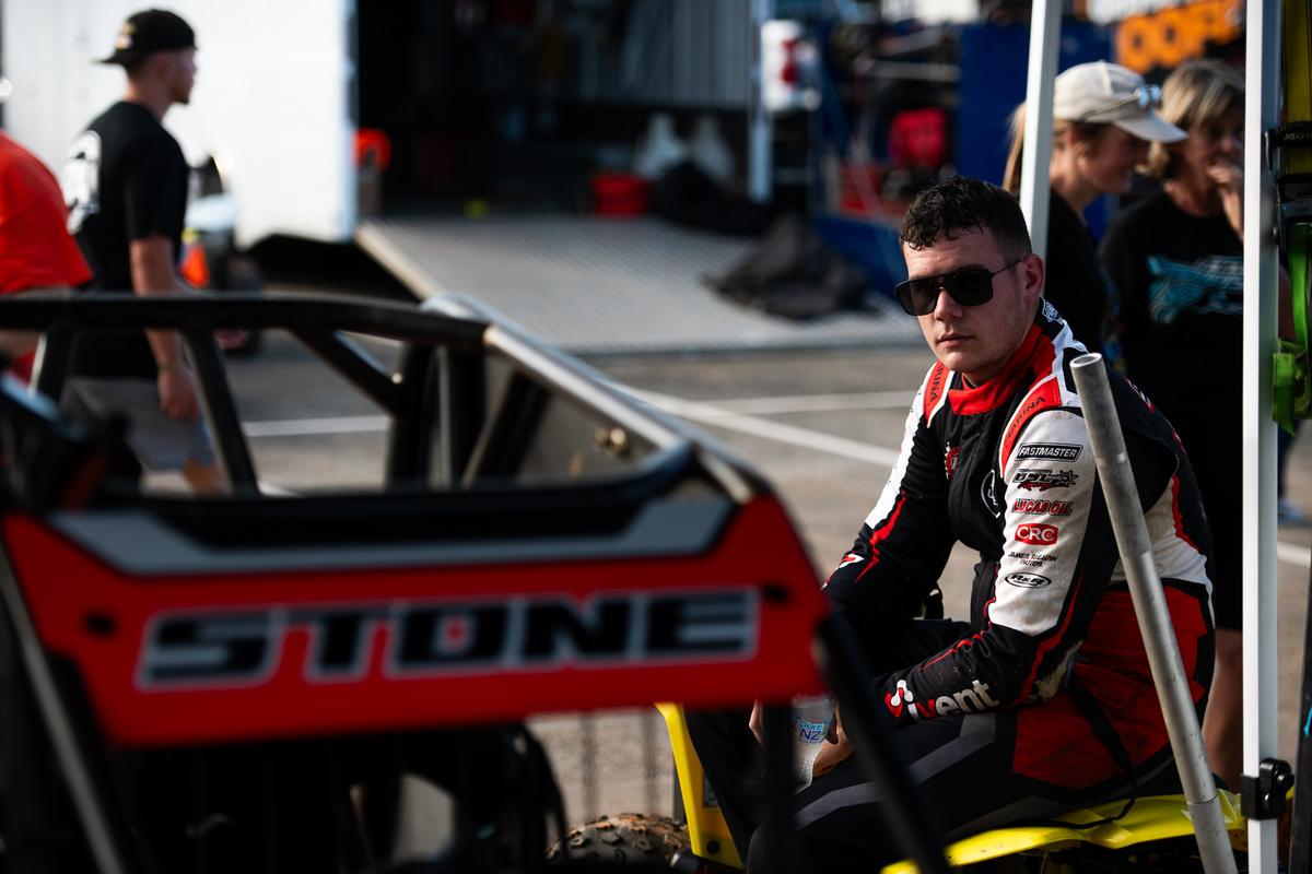 Nathan Smith;73M;Carlos Stone looking over his midget car before a race
