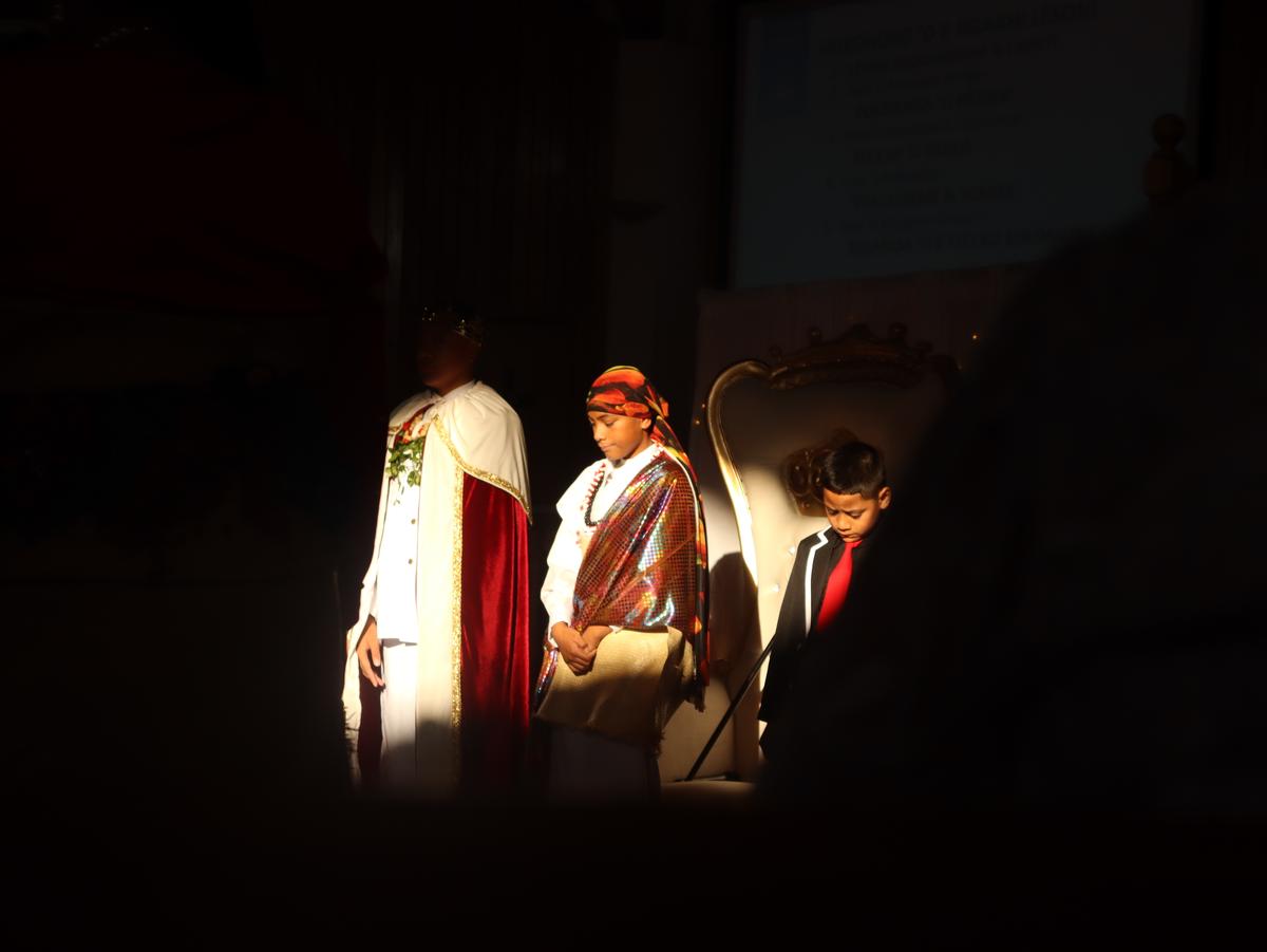 Rose Fifita;Future in ceremony;This photo captures young Tongans standing in tradition, framed by light and shadow. It speaks to pride, responsibility, and the power of passing culture down to the next generation.