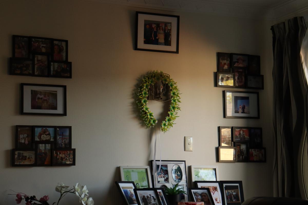 Rose Fifita;Home is the frame;This is the wall in my family’s home, covered in photos from first birthdays, 21sts, weddings, and everything in between. Each frame holds a memory, a person, a moment we’re proud of. It’s where our culture lives every day, not just in big events, but in how we honour them, remember them, and hang them right where we can see them.