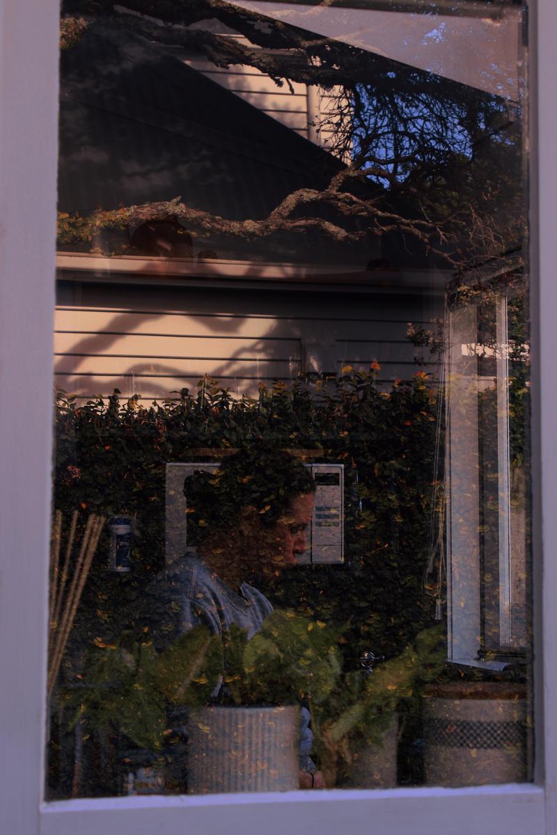 Uriel de Proença Ruiz;In Between Spaces;A quiet moment captured between inside and outside, presence and reflection. This image explores how stillness can hold many layers, like light, memory, and emotion dissolved in everyday intimacy.