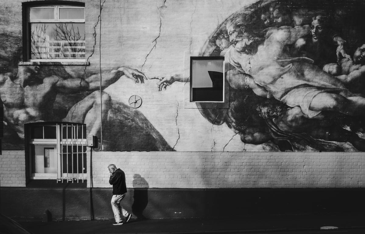 Yechang chen;Renaissance Reverie;A thought provoking black and white shot blending a mural of Michelangelo’s